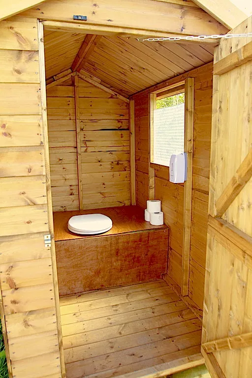 Inside one of the composting toilet cubicles